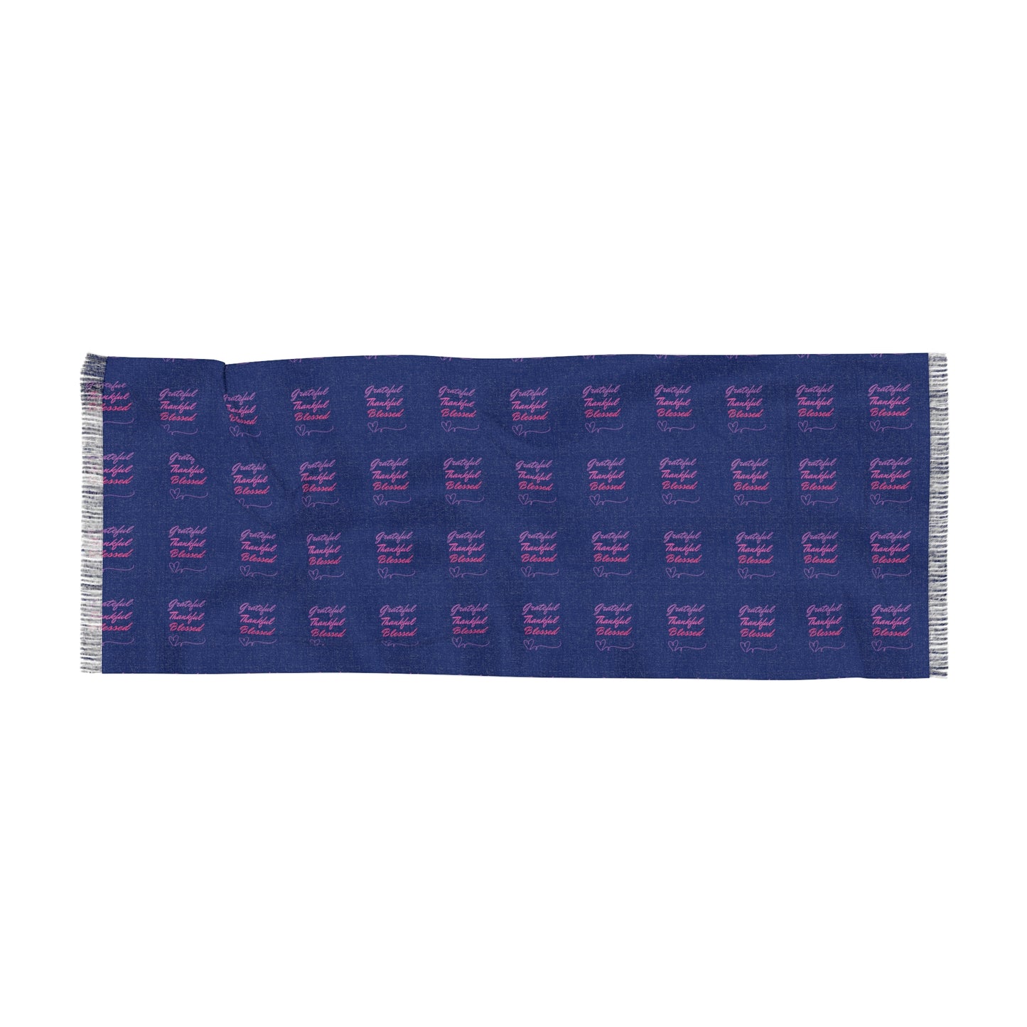 A blue fabric or scarf with a repeating pattern of the text "Grateful Thankful Blessed" written in pink and purple cursive font.