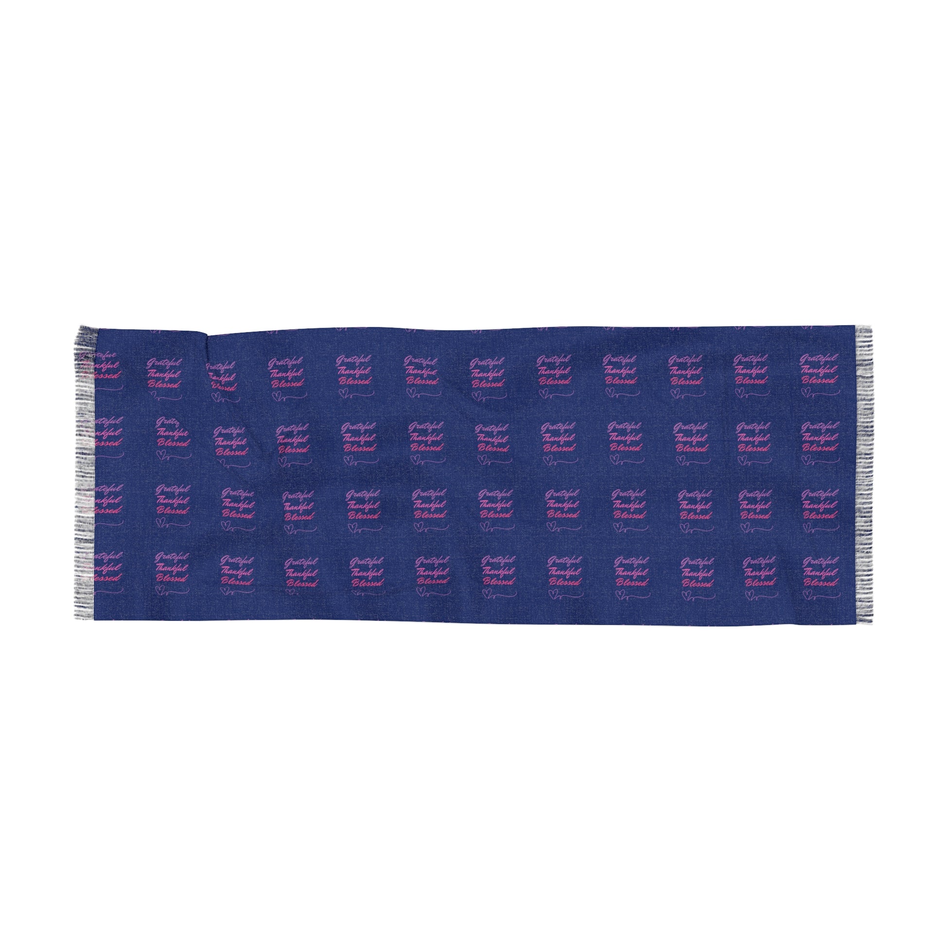 A blue fabric or scarf with a repeating pattern of the text "Grateful Thankful Blessed" written in pink and purple cursive font.