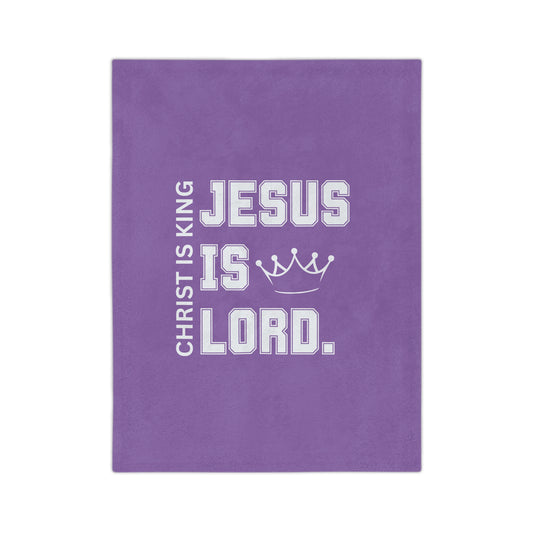 Purple cloth with white text that says "Jesus is Lord."