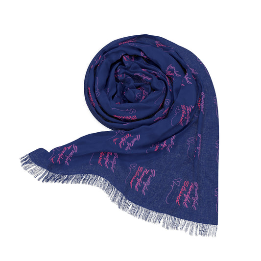 A blue scarf with a fringed edge, featuring the words "Grateful, Thankful, Blessed" printed in a repeating pattern.