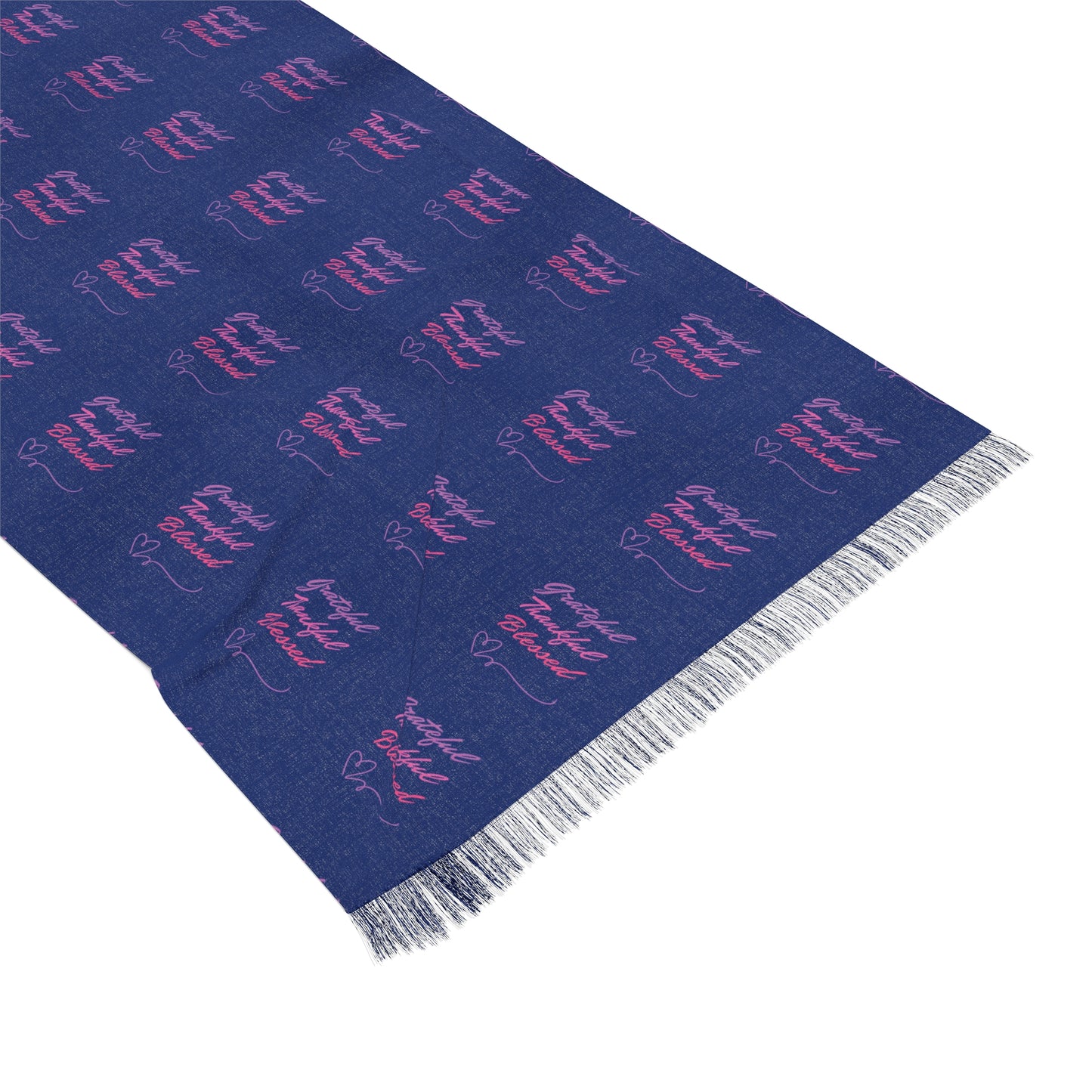 A blue scarf with the words "Grateful, Thankful, Blessed" repeated in a pattern